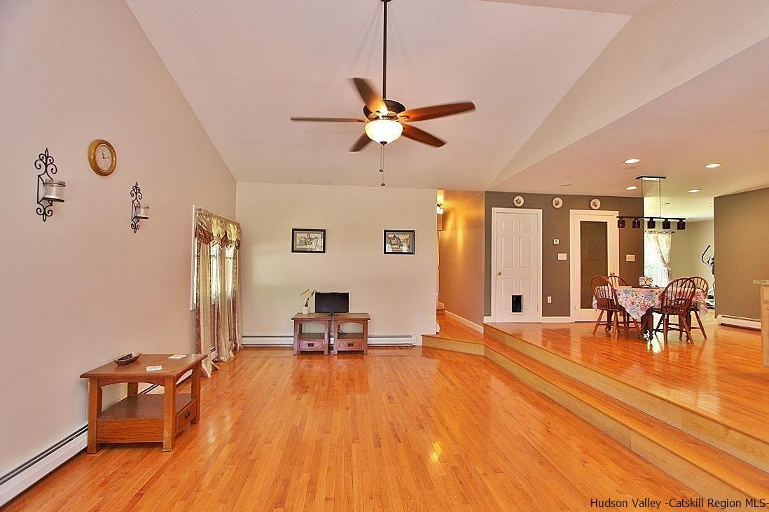 124 Blue Mountain Road Saugerties, NY 12477 - Photo 3 of 29 a view of a dining room with furniture window and wooden floor