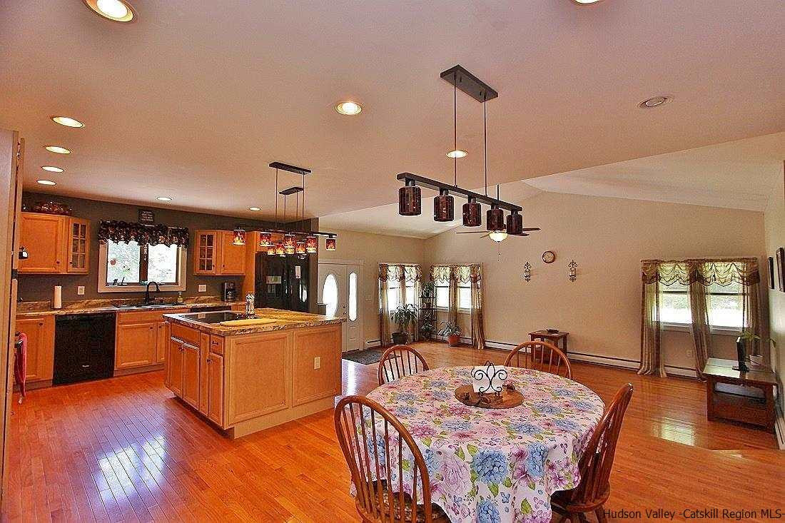 124 Blue Mountain Road Saugerties, NY 12477 - Photo 7 of 29 a kitchen with stainless steel appliances granite countertop sink stove top oven and cabinets