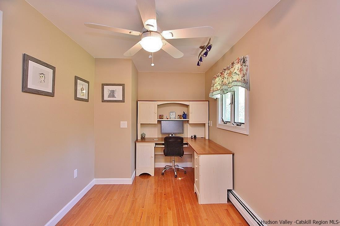 124 Blue Mountain Road Saugerties, NY 12477 - Photo 9 of 29 a view of a workspace with furniture and a chandelier