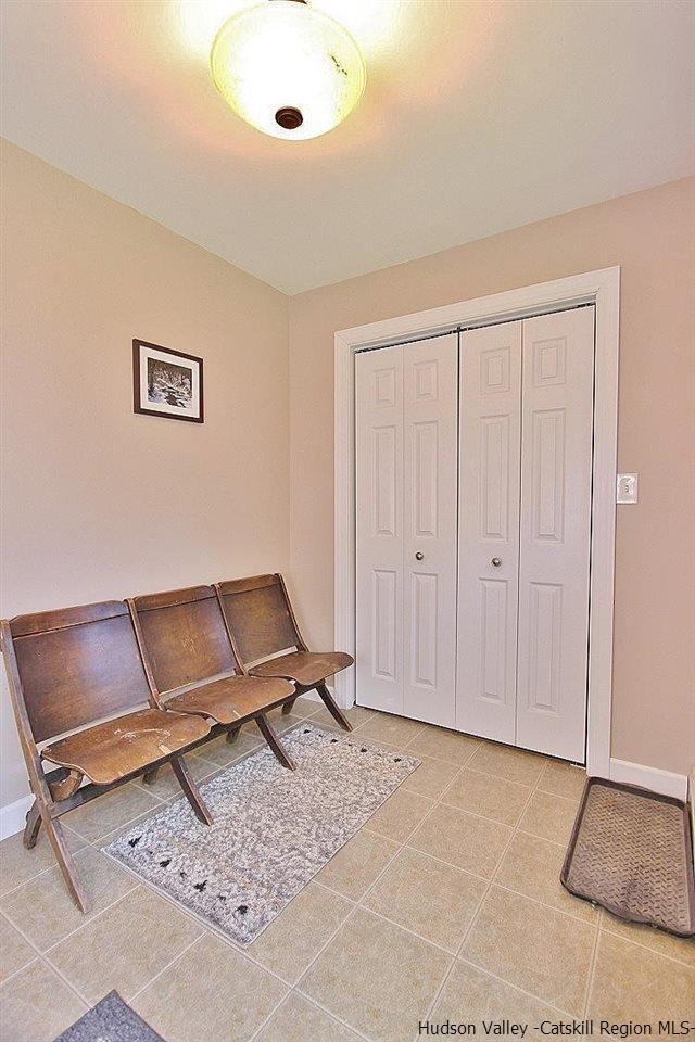 124 Blue Mountain Road Saugerties, NY 12477 - Photo 10 of 29 a living room with a couch and a night stand
