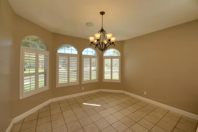 a kitchen with a cabinets and chandelier