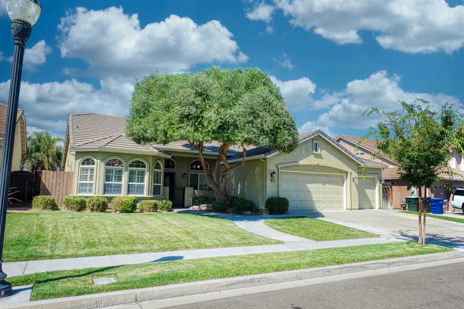 849 Miraggio Drive Patterson, CA 95363 - Photo 2 of 40 a front view of a house with a garden