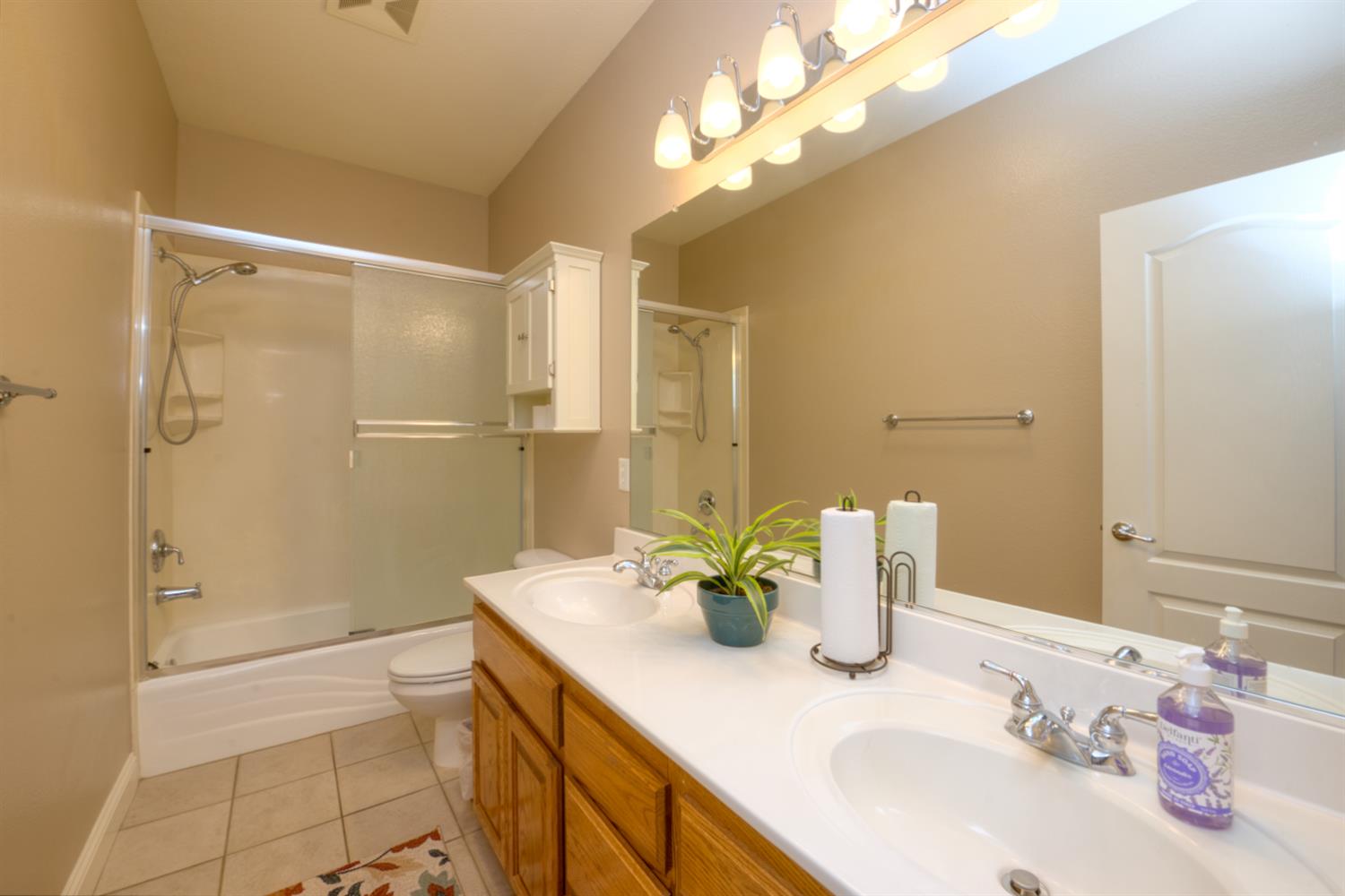 849 Miraggio Drive Patterson, CA 95363 - Photo 23 of 40 a bathroom with a sink a toilet and shower