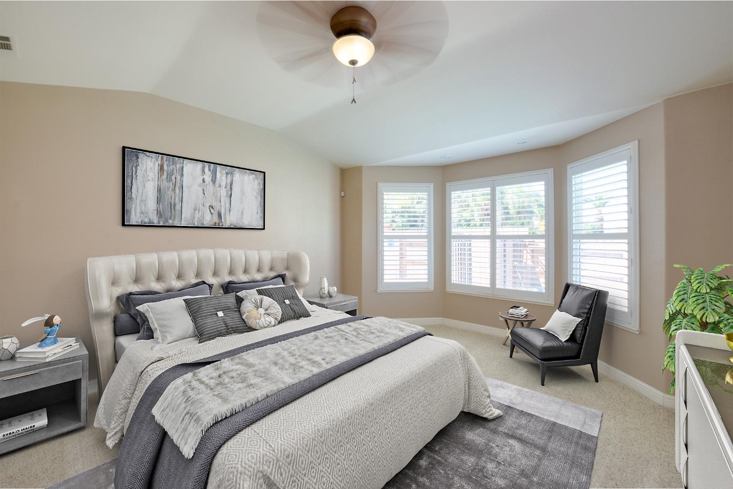 849 Miraggio Drive Patterson, CA 95363 - Photo 24 of 40 a bedroom with a bed and glass window