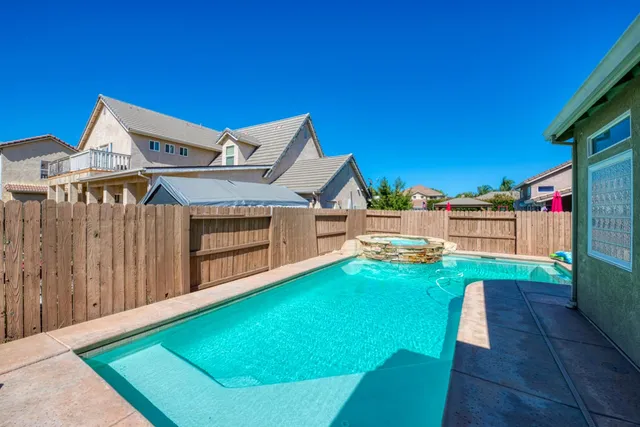 a view of a backyard with a small cabin