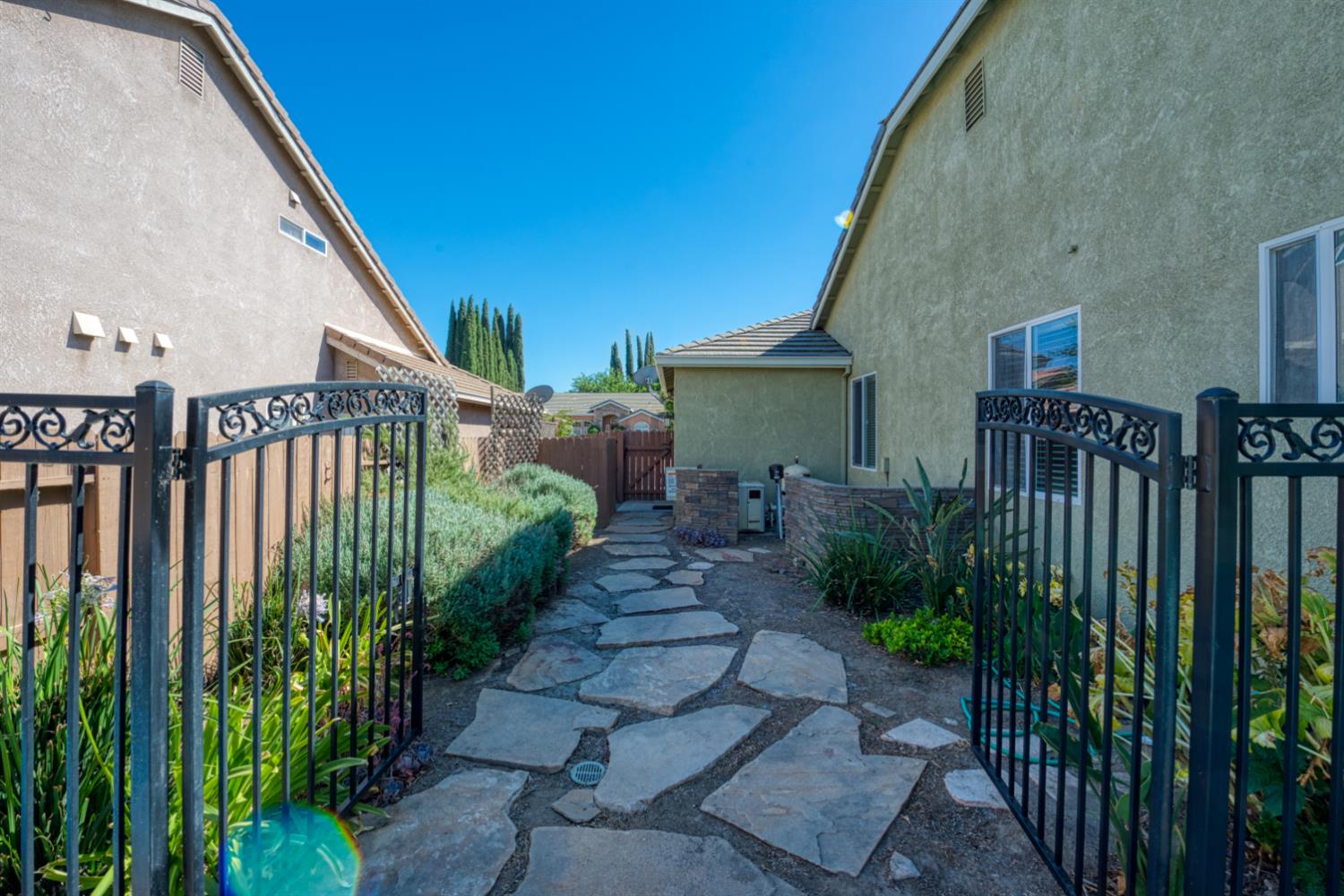 849 Miraggio Drive Patterson, CA 95363 - Photo 37 of 40 a view of a house with backyard and plants