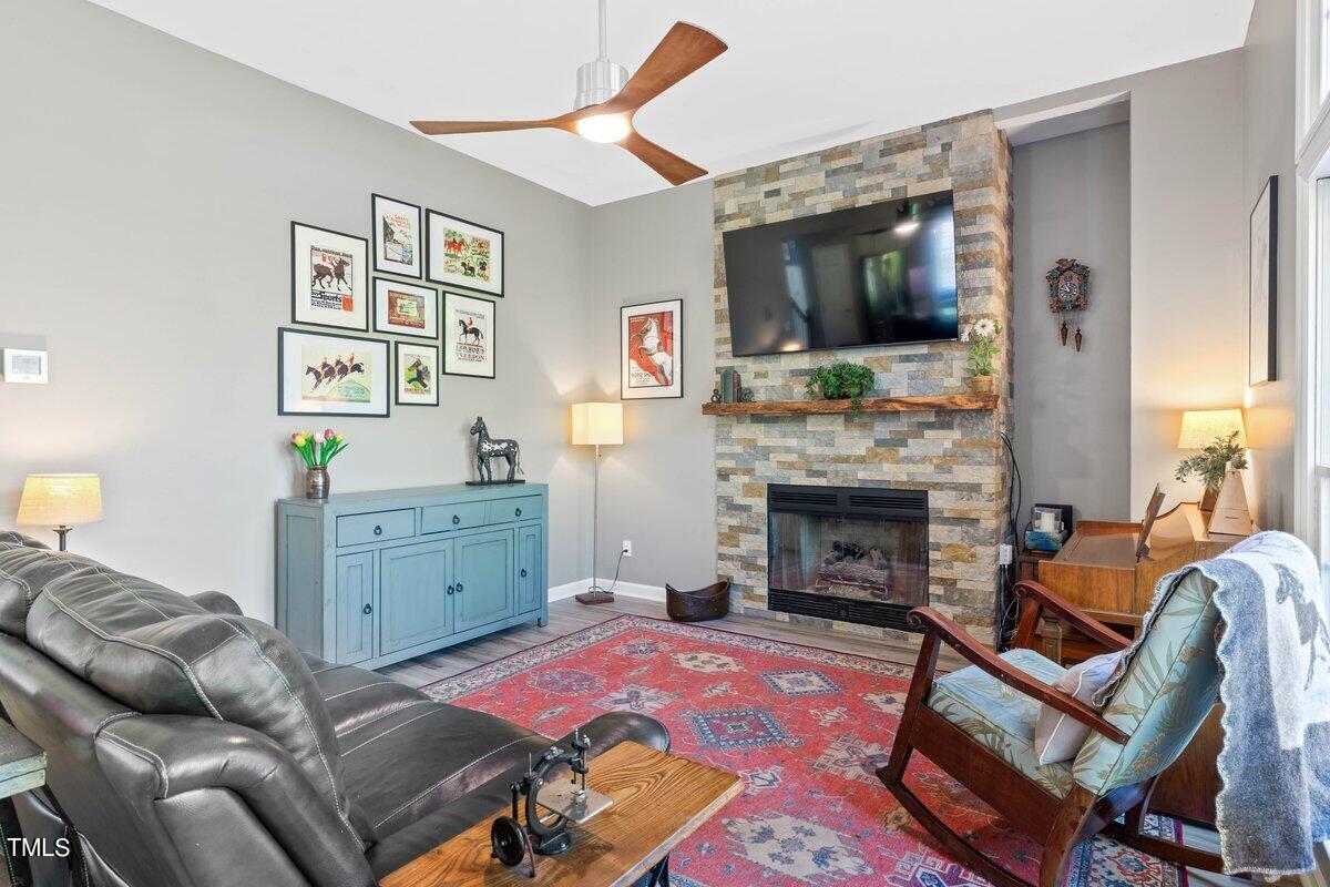 1103 Pearson Farms Road Apex, NC 27502 - Photo 12 of 58 Stone is stunning on this fireplace!
