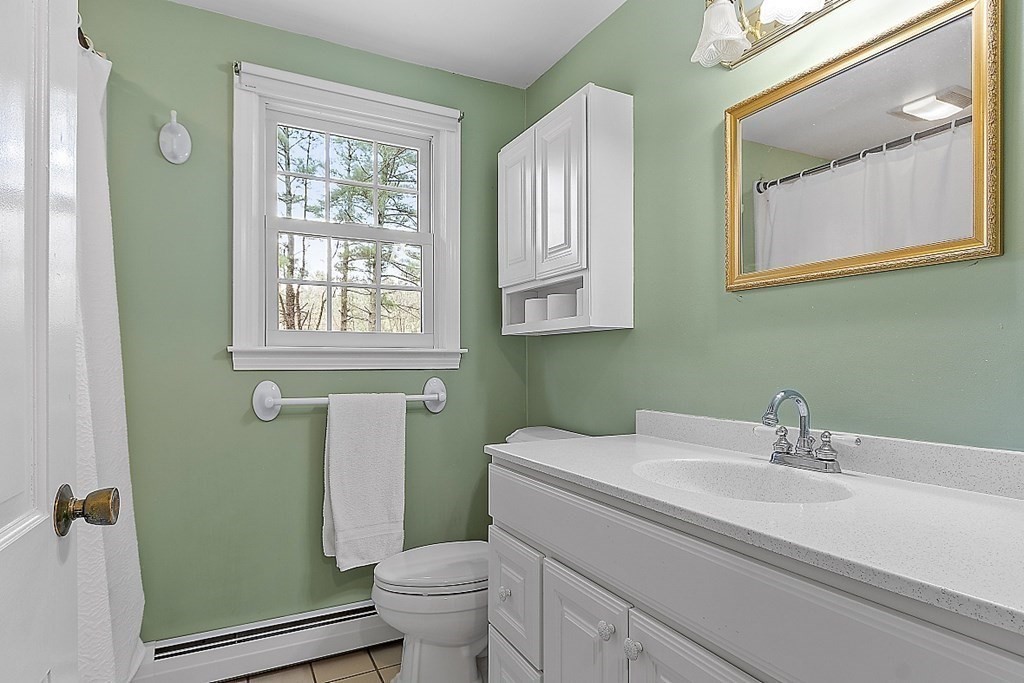 13 Eldridge Road Harvard, MA 01451 - Photo 23 of 40 a bathroom with a sink toilet and a mirror