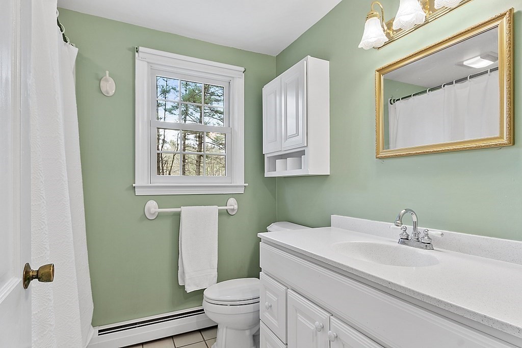 13 Eldridge Road Harvard, MA 01451 - Photo 24 of 40 a bathroom with a sink a toilet and a mirror