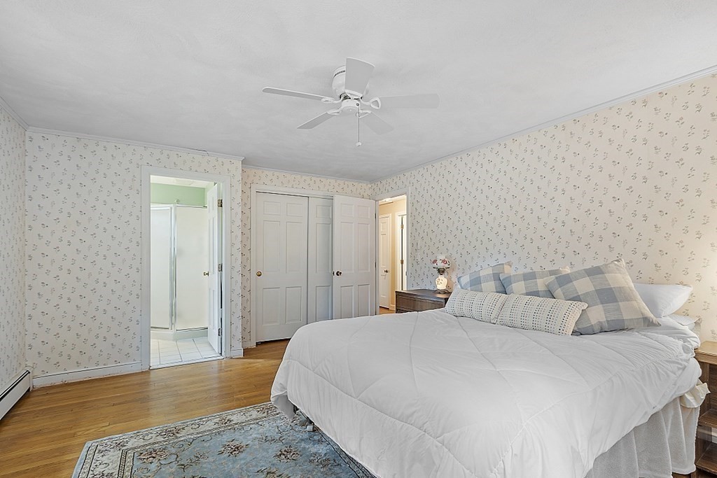 13 Eldridge Road Harvard, MA 01451 - Photo 29 of 40 a bedroom with a bed and wooden floor