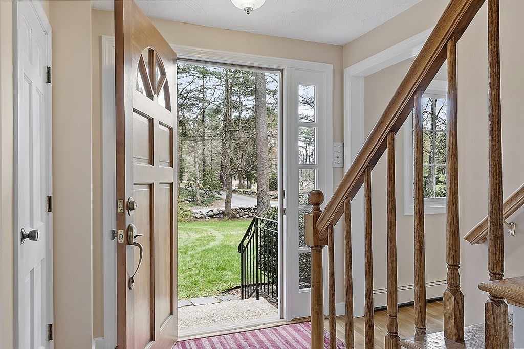 13 Eldridge Road Harvard, MA 01451 - Photo 3 of 40 a view of an entryway with wooden floor and stairs