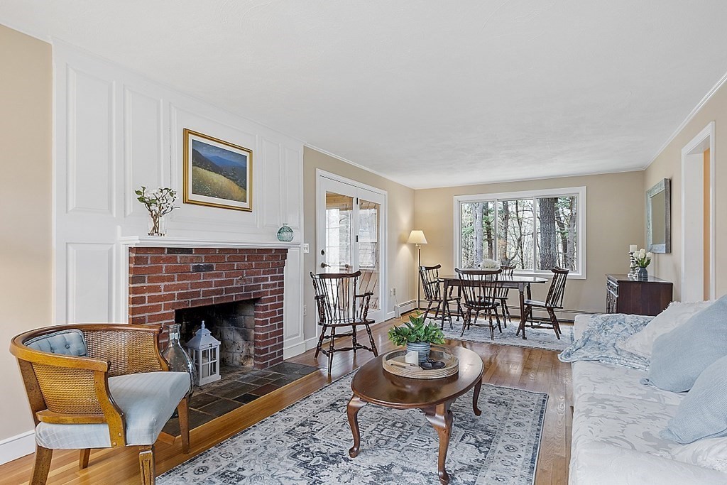 13 Eldridge Road Harvard, MA 01451 - Photo 6 of 40 a living room with furniture and a fireplace