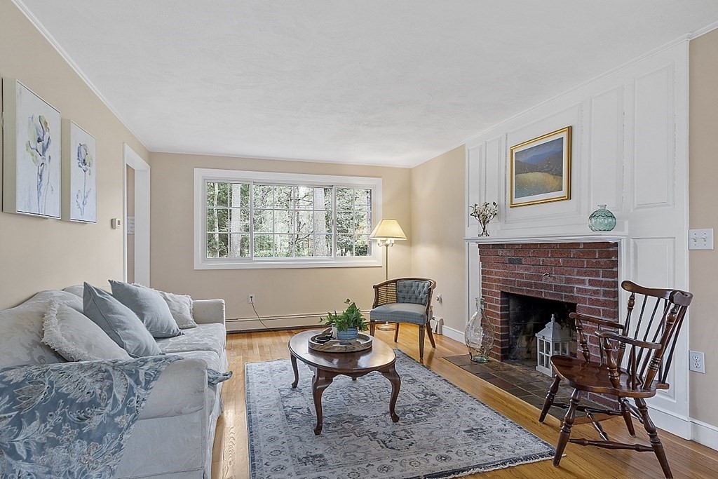 13 Eldridge Road Harvard, MA 01451 - Photo 7 of 40 a living room with furniture a window and a fireplace