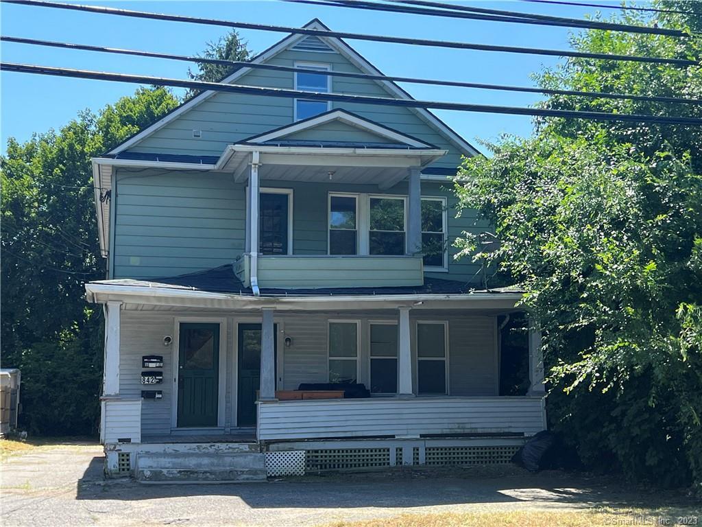 84 Winsted Road Torrington, CT 06790 - Photo 1 of 1 a front view of a house with a garden