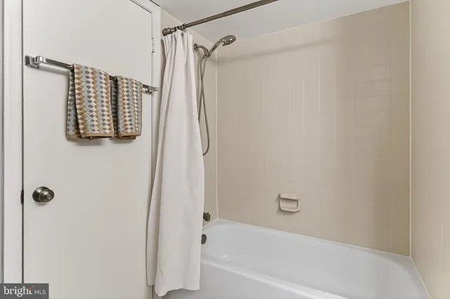 a bathroom with a shower and a bathtub