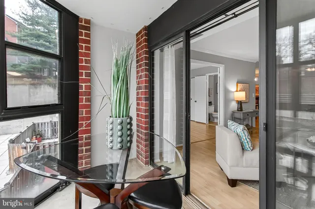 a view of workspace with wooden floor and windows