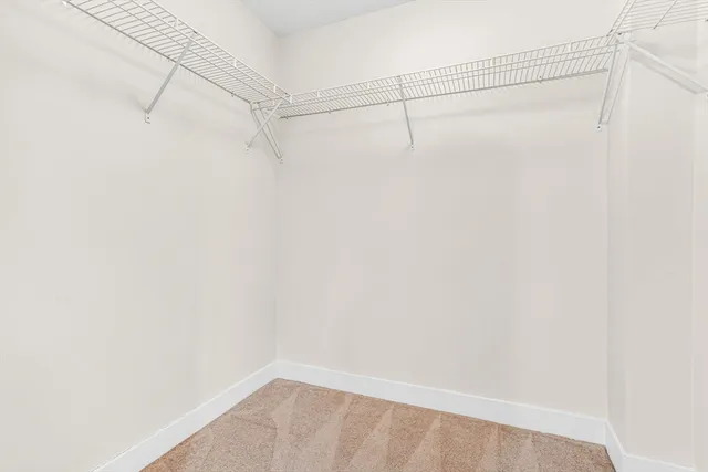 a bathroom with a double vanity sink toilet and shower