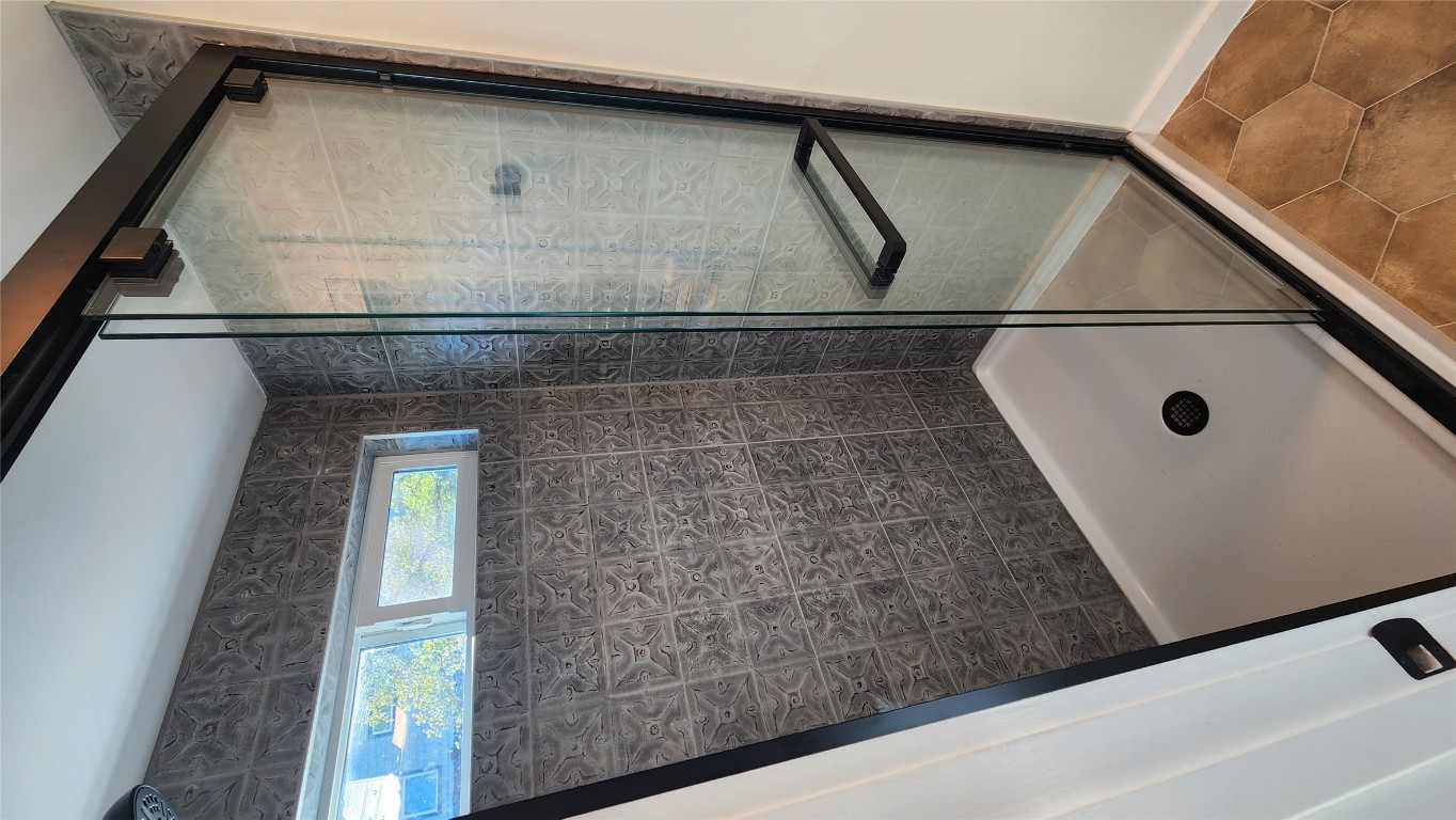 1134 Lott Avenue Austin, TX 78721 - Photo 16 of 32 a bathroom with a shower