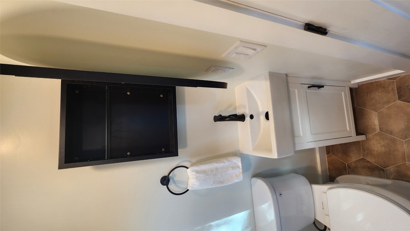 1134 Lott Avenue Austin, TX 78721 - Photo 17 of 32 Newly installed medicine cabinet mirror (open) for more storage. 11-23