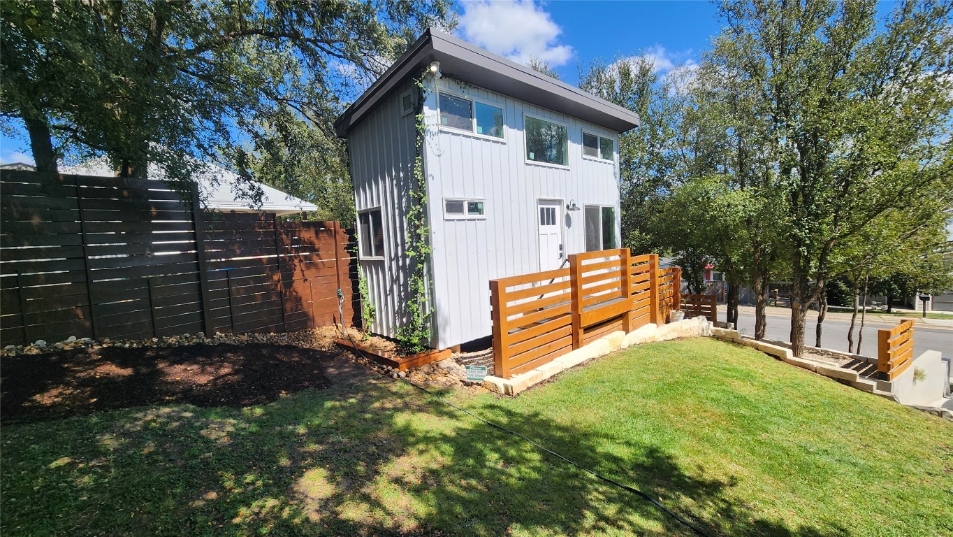 1134 Lott Avenue Austin, TX 78721 - Photo 3 of 32 a view of backyard with wooden fence and a large tree