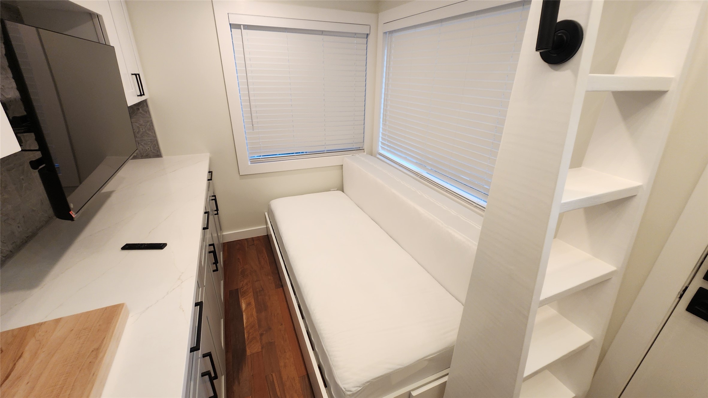 1134 Lott Avenue Austin, TX 78721 - Photo 8 of 32 Removable custom split queen couch bed attached to moldings (not flooring) that pulls out for split queen bed.