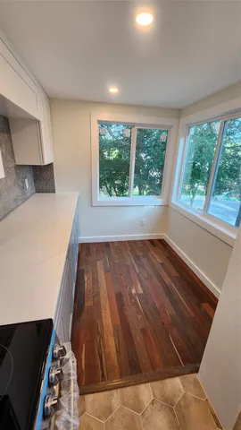 a view of entryway with wooden floor