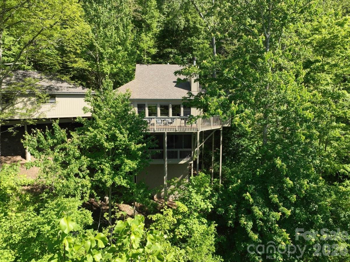 121 Ivy Ridge Road Burnsville, NC 28714 - Photo 2 of 48 a view of a house with a backyard and sitting area