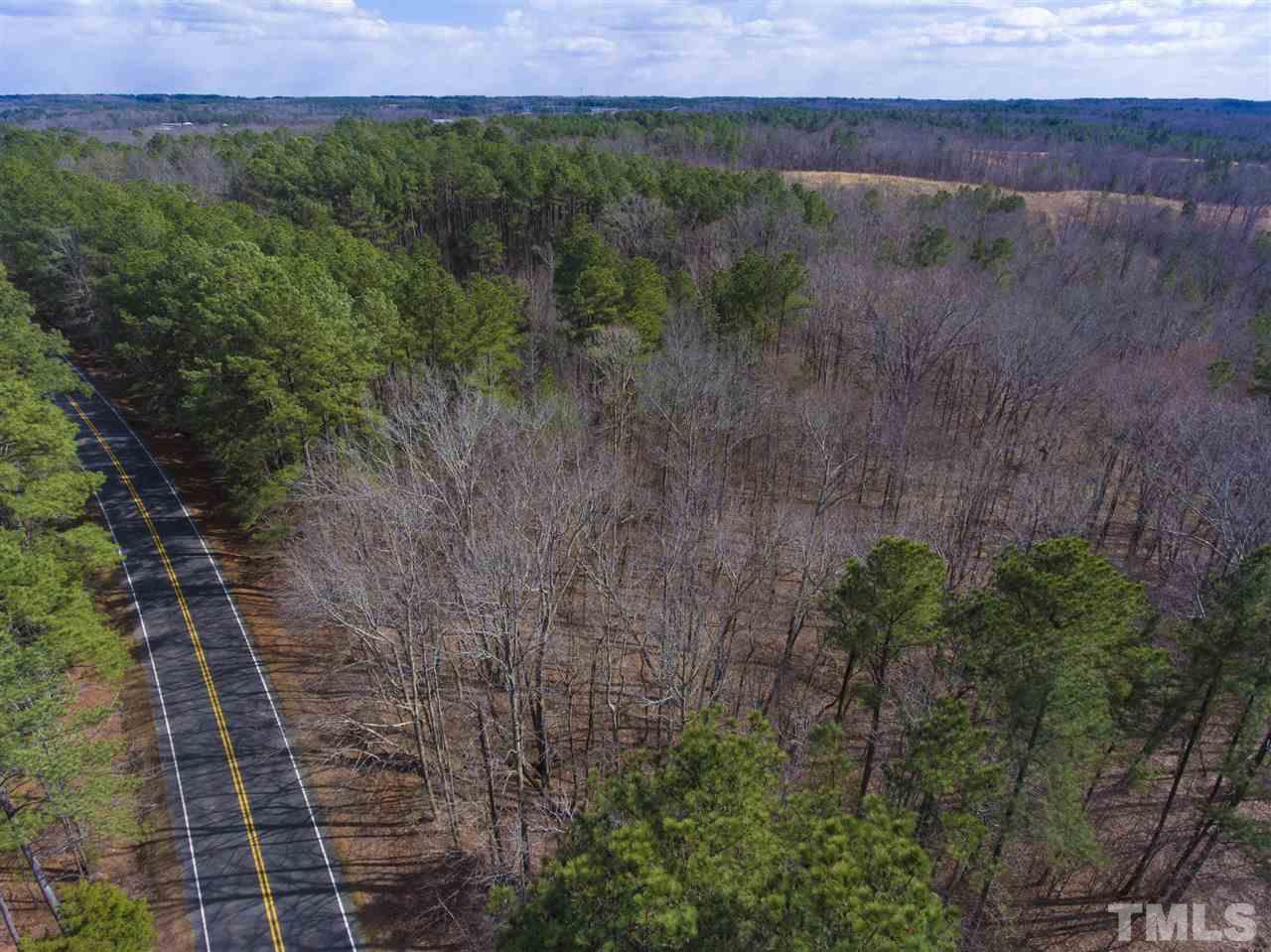 5304 Kemp Road Durham, NC 27703 - Photo 4 of 22 a view of a dry yard with large trees