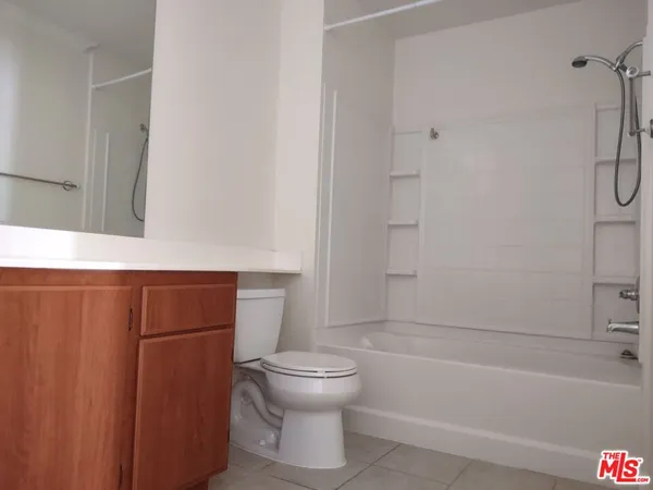 a bathroom with a toilet and a bathtub