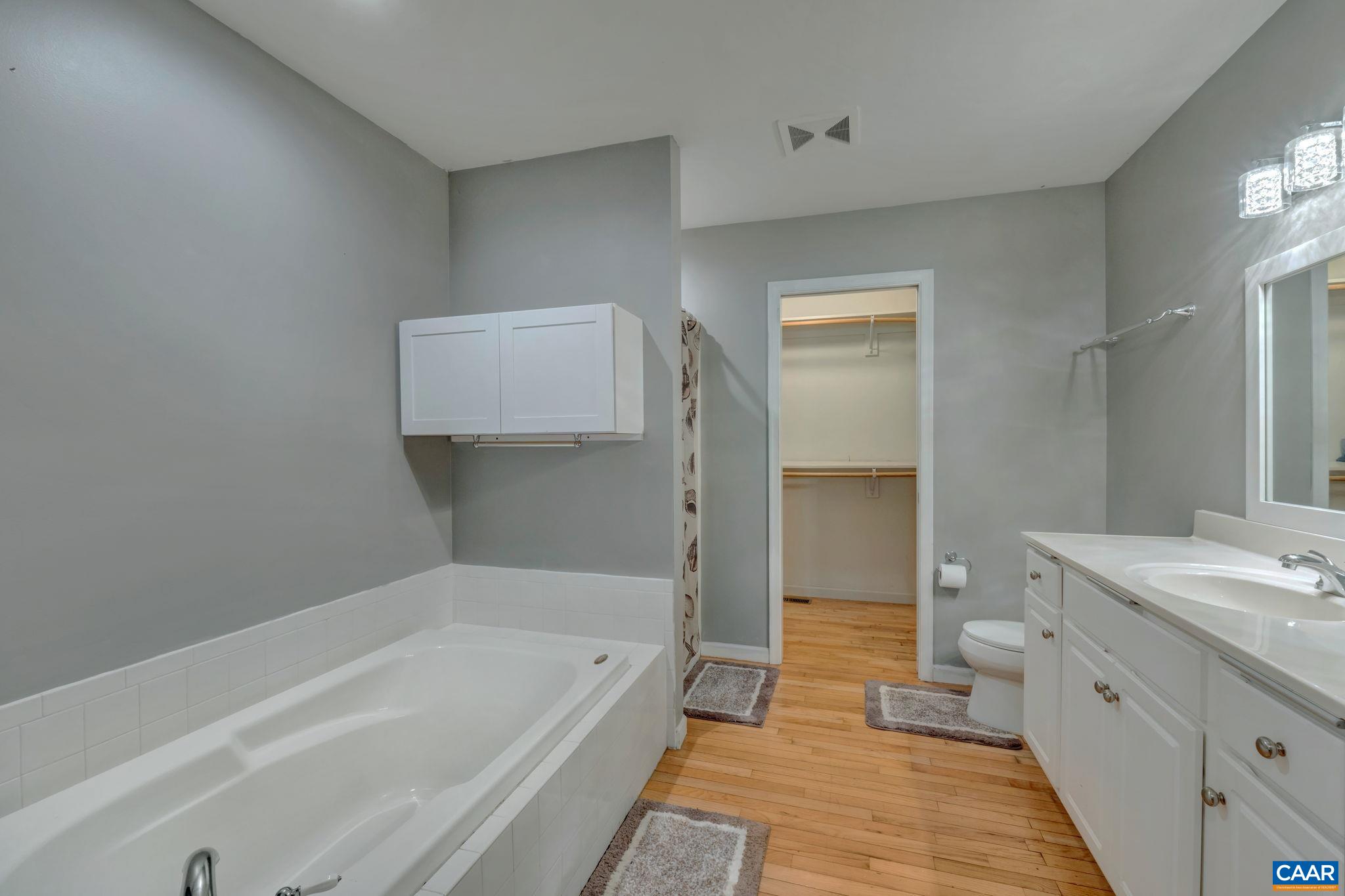 193 Jordan Store Road Kents Store, VA 23084 - Photo 17 of 45 a bathroom with a tub sink and mirror