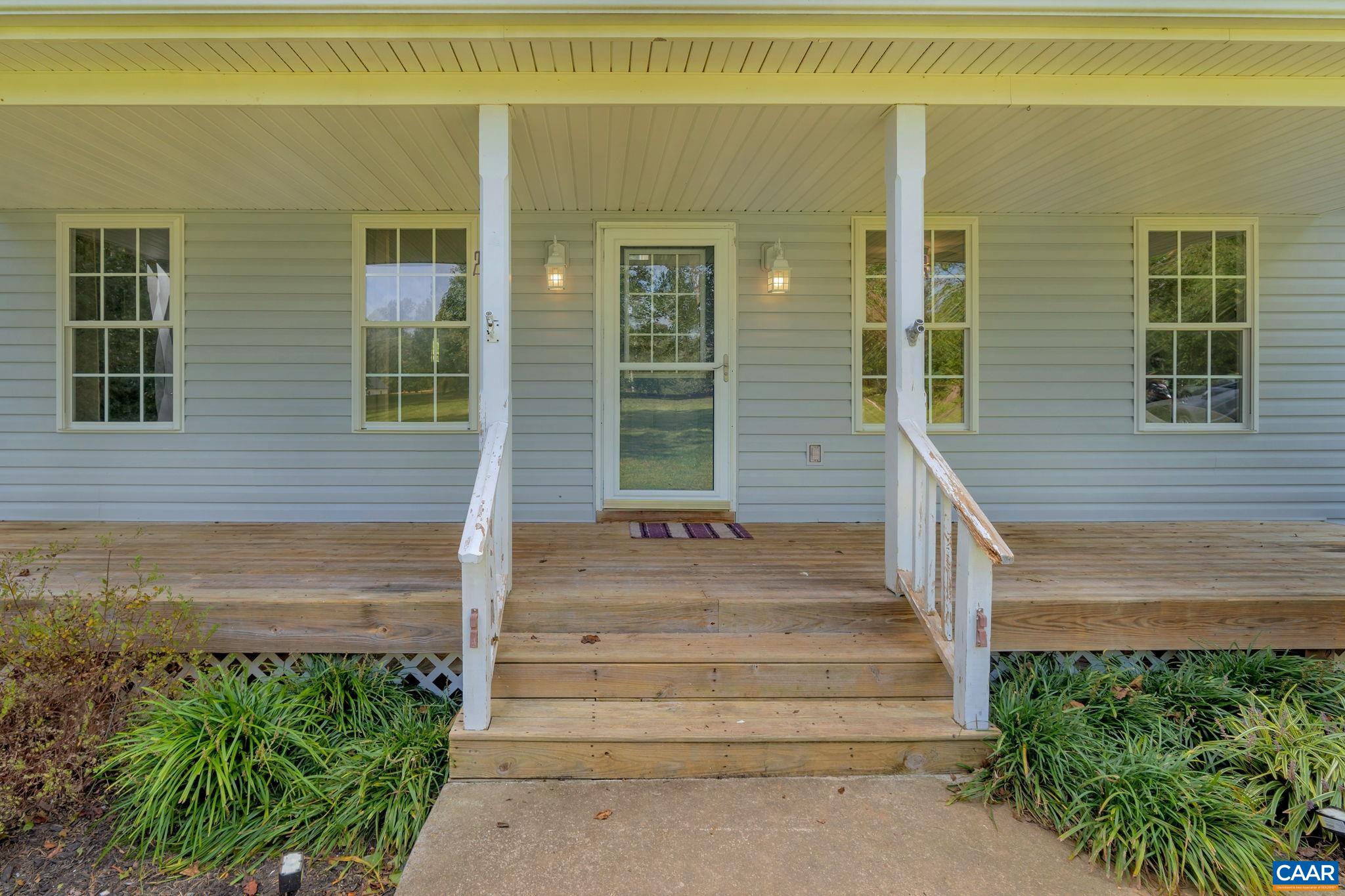 193 Jordan Store Road Kents Store, VA 23084 - Photo 2 of 45 a front view of a house with a garden