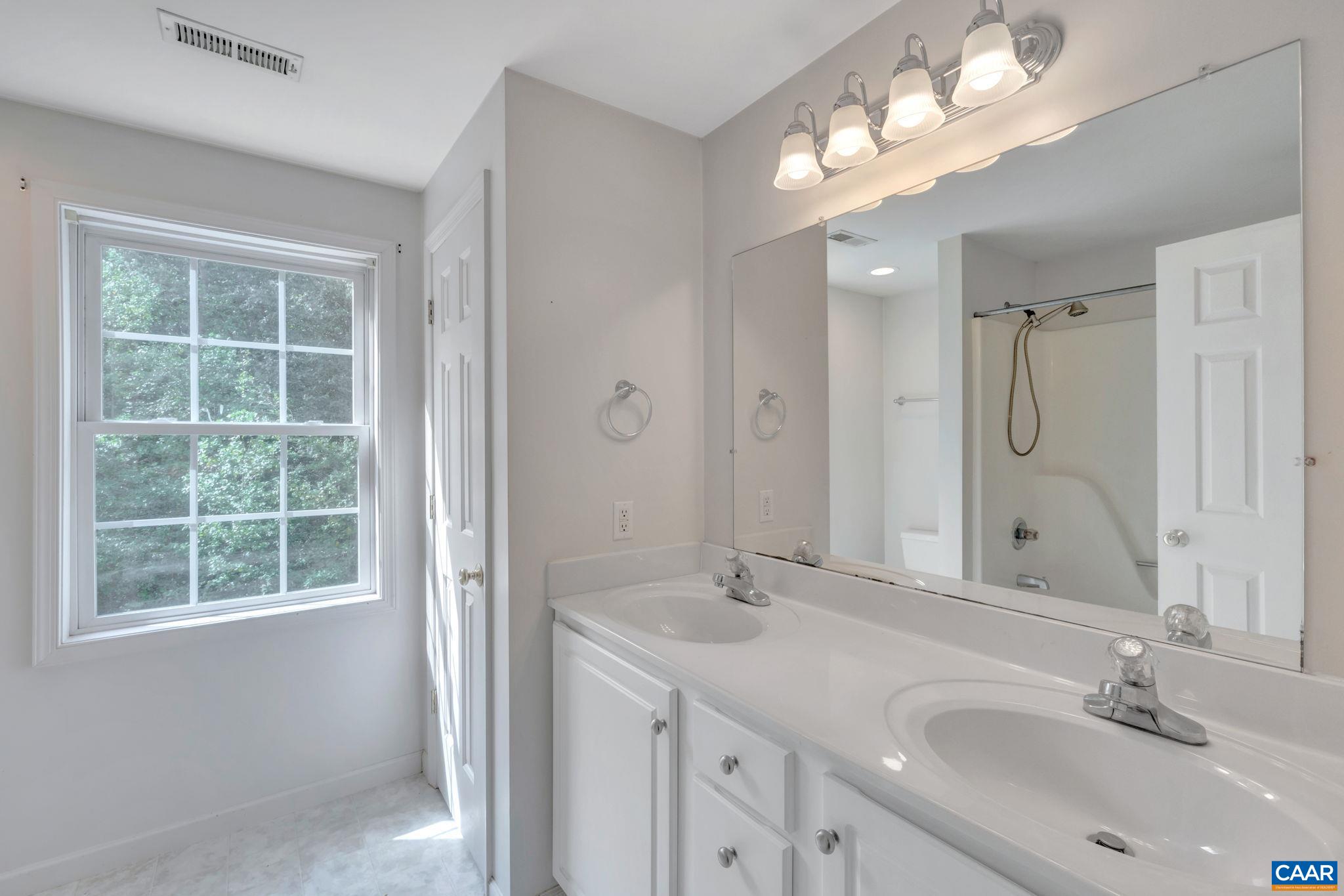 193 Jordan Store Road Kents Store, VA 23084 - Photo 27 of 45 a bathroom with a sink double vanity and a mirror