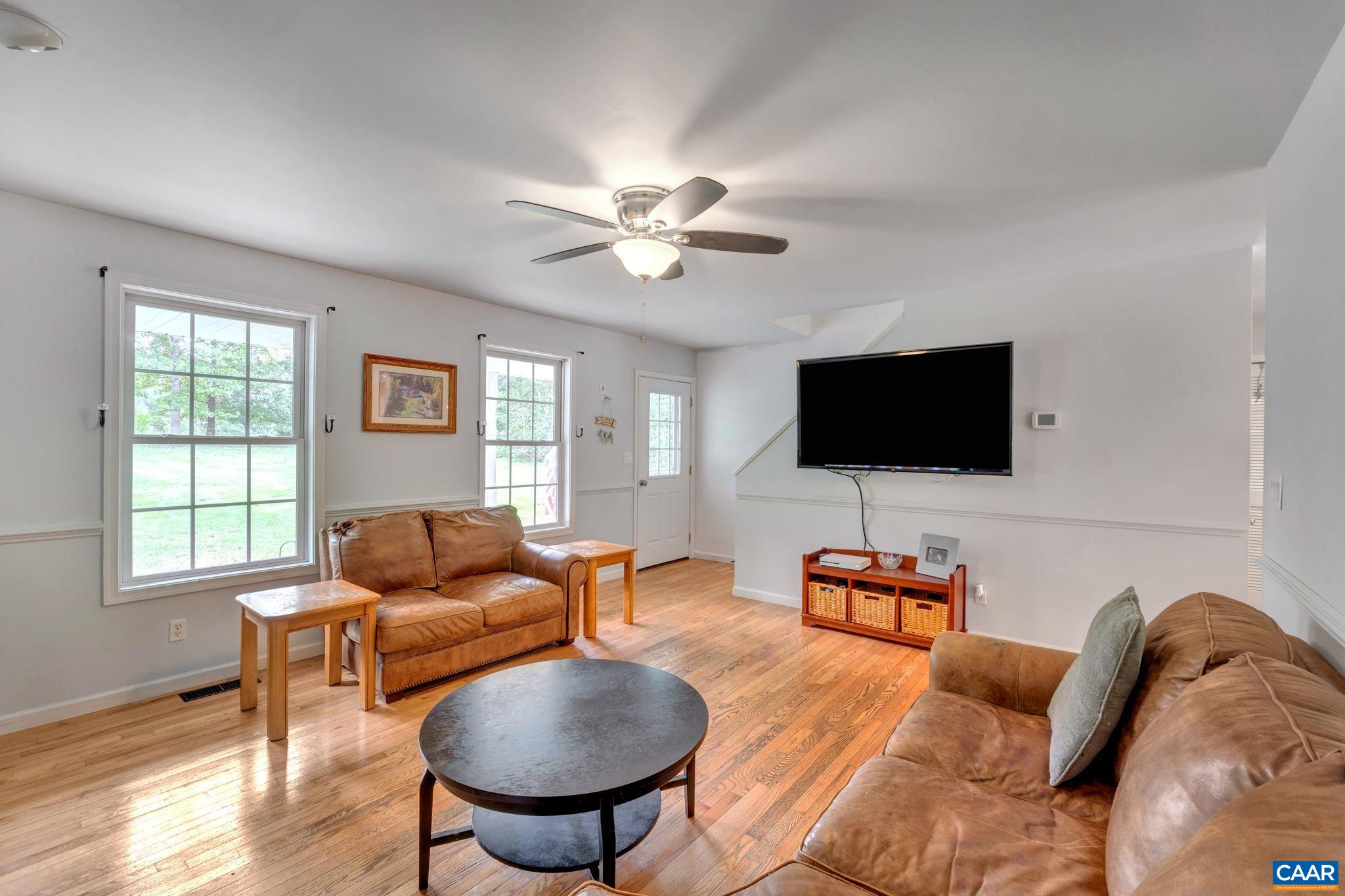 193 Jordan Store Road Kents Store, VA 23084 - Photo 6 of 45 a living room with furniture and a flat screen tv