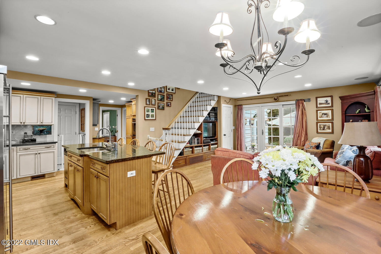 20 Crescent Road Riverside, CT 06878 - Photo 16 of 46 a view of a dining room with furniture a chandelier and wooden floor