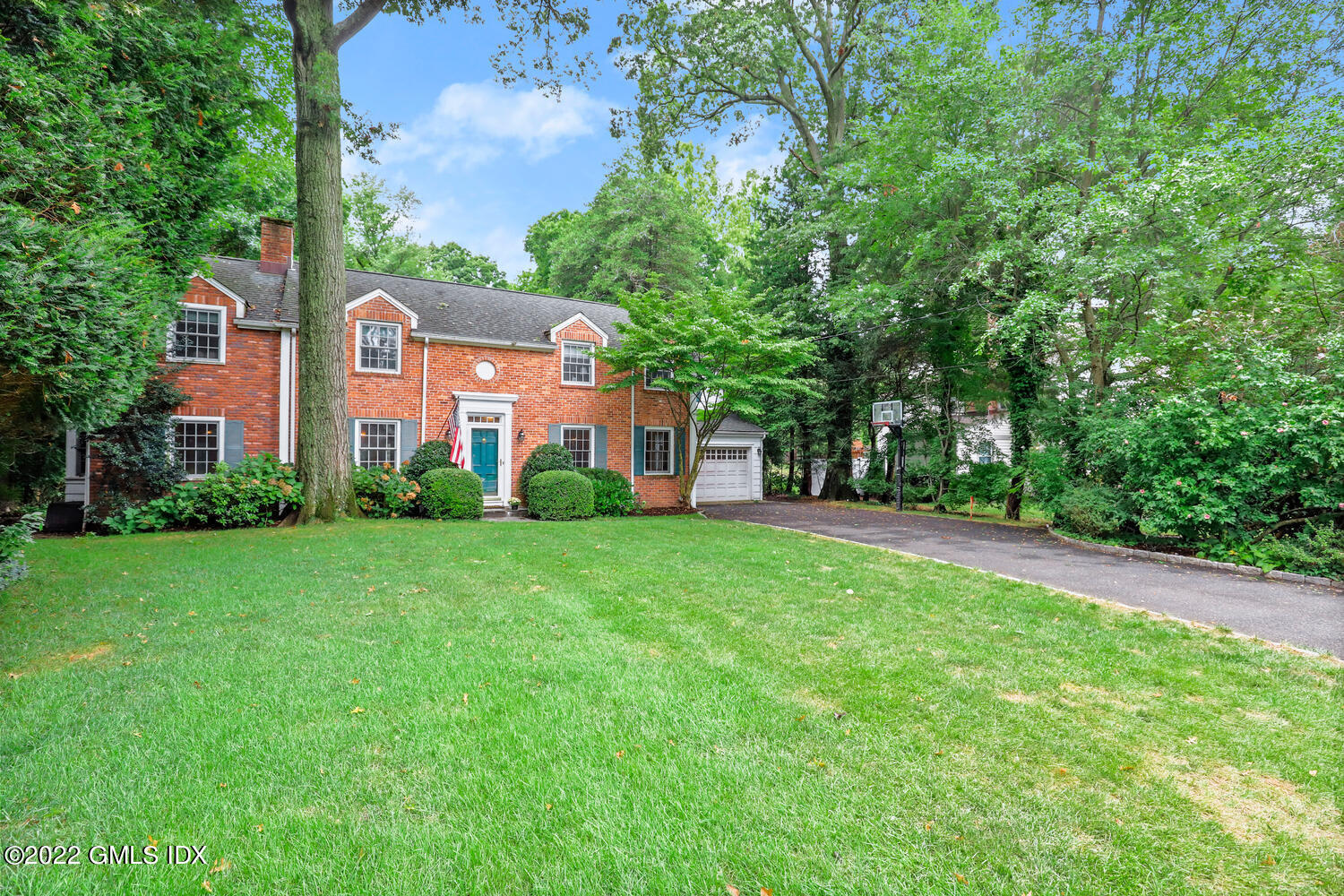 20 Crescent Road Riverside, CT 06878 - Photo 3 of 46 a front view of a house with a yard