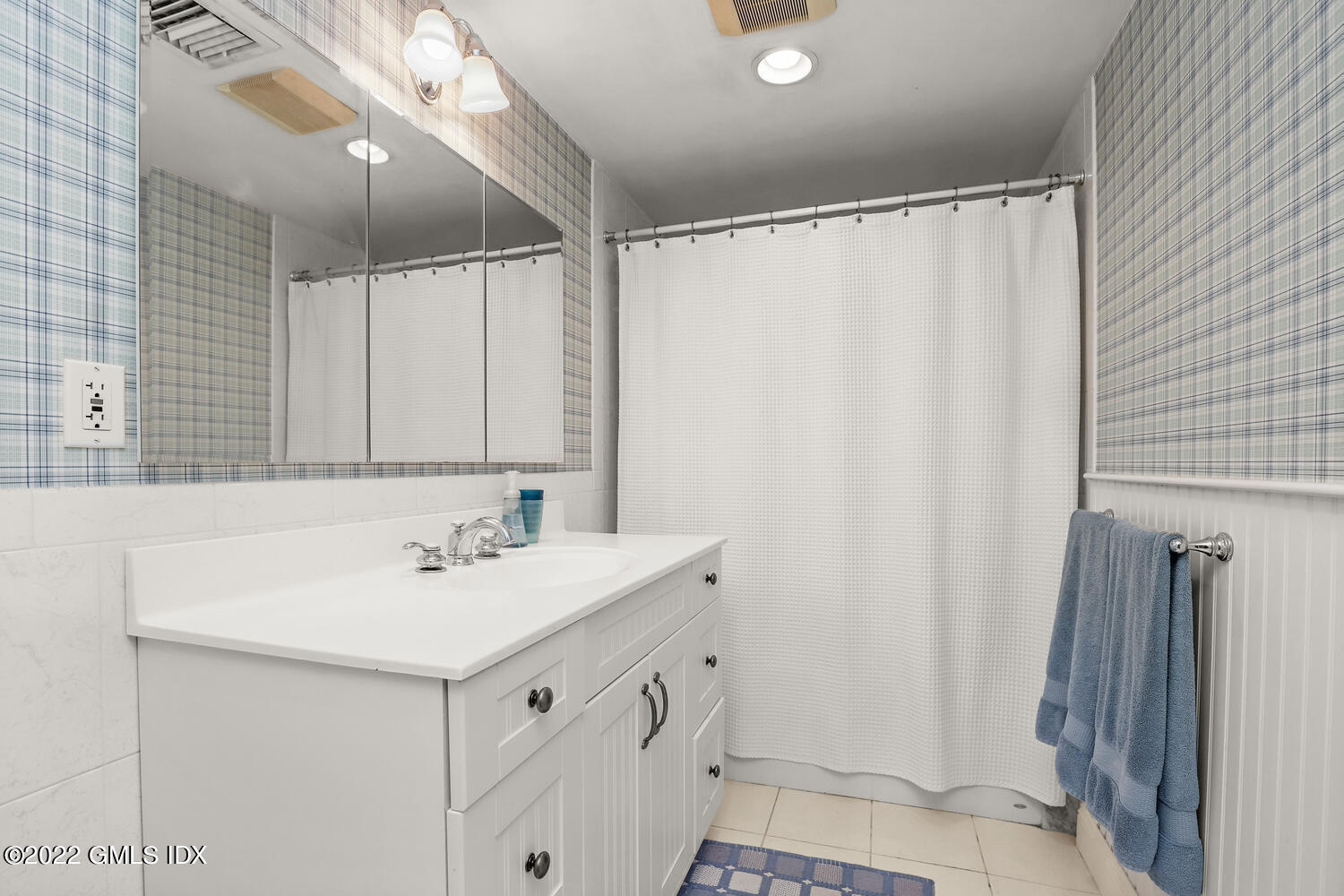 20 Crescent Road Riverside, CT 06878 - Photo 32 of 46 a bathroom with a sink and a mirror