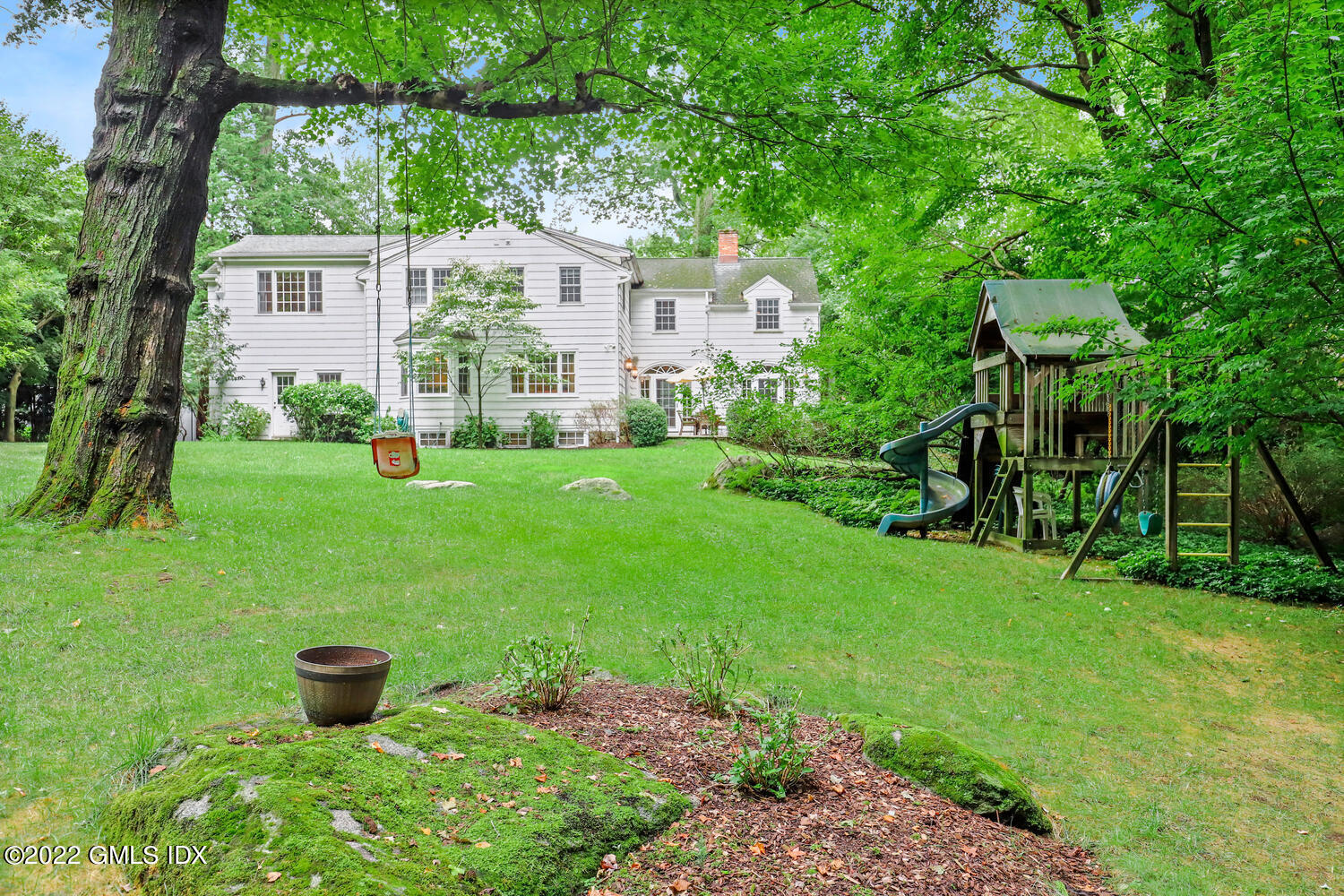 20 Crescent Road Riverside, CT 06878 - Photo 37 of 46 a view of a house with backyard sitting area and garden