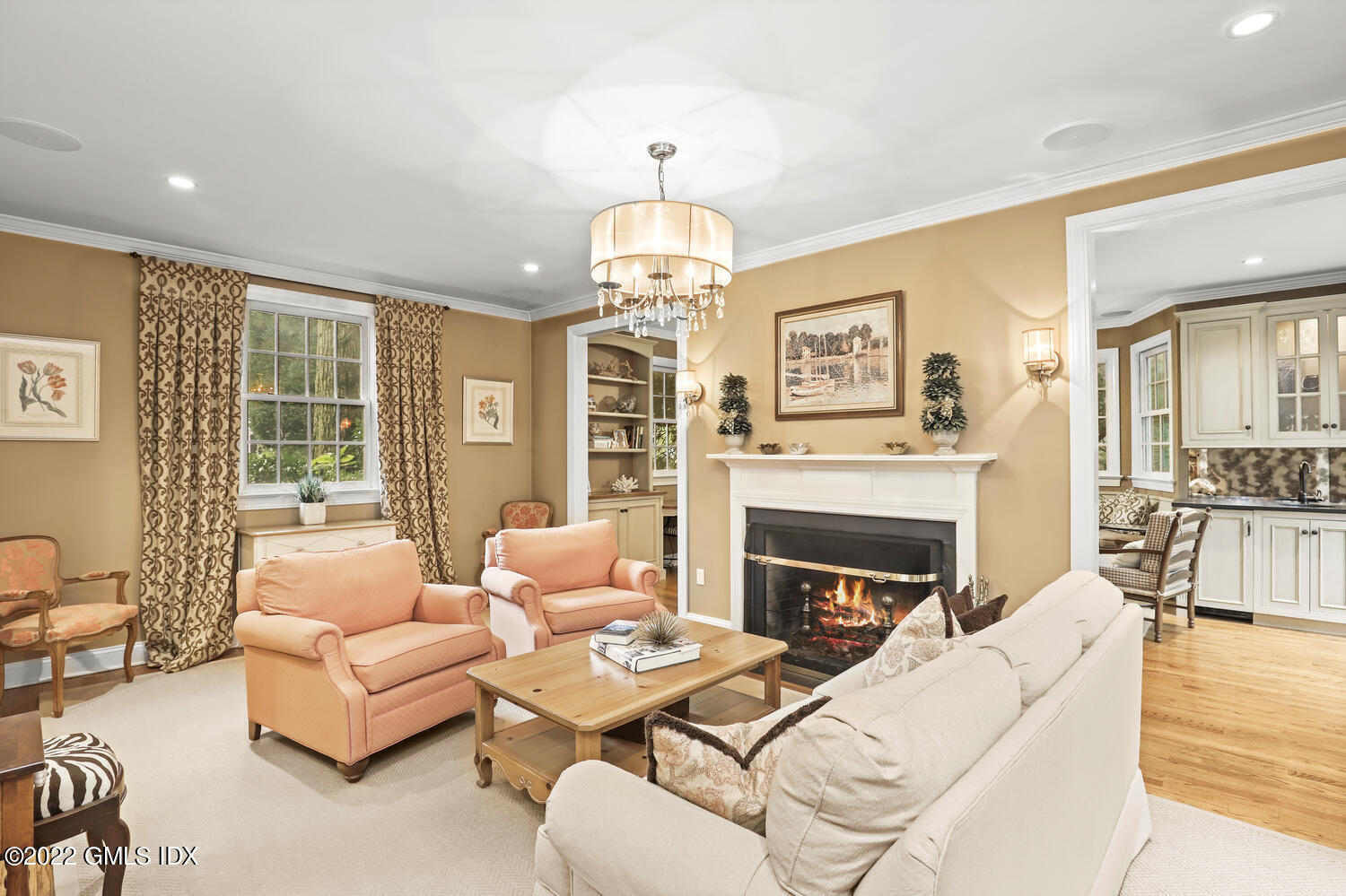 20 Crescent Road Riverside, CT 06878 - Photo 5 of 46 a living room with furniture a fireplace and a large mirror