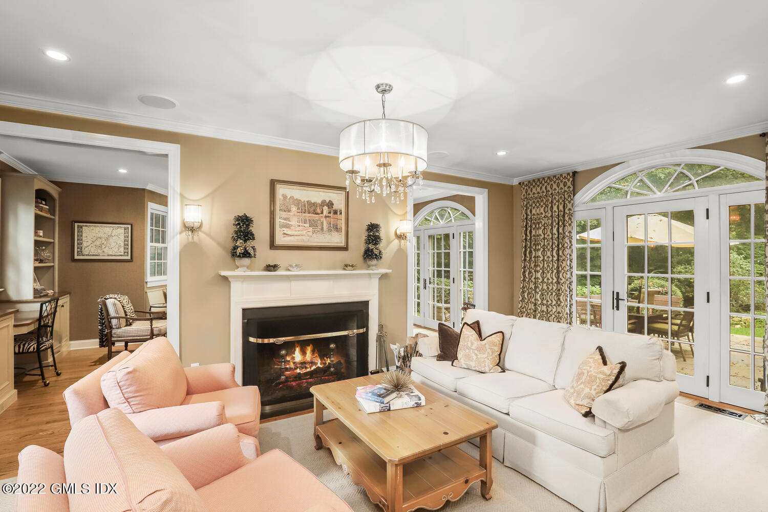 20 Crescent Road Riverside, CT 06878 - Photo 6 of 46 a living room with furniture a fireplace and a chandelier