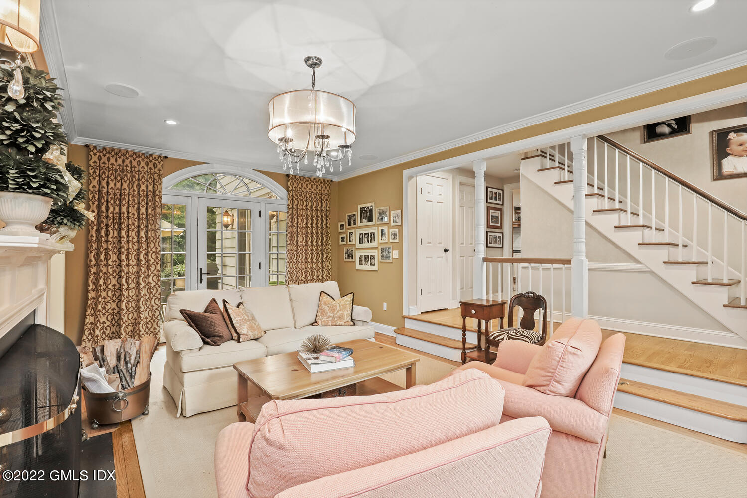 20 Crescent Road Riverside, CT 06878 - Photo 7 of 46 a living room with furniture chandelier and a large window
