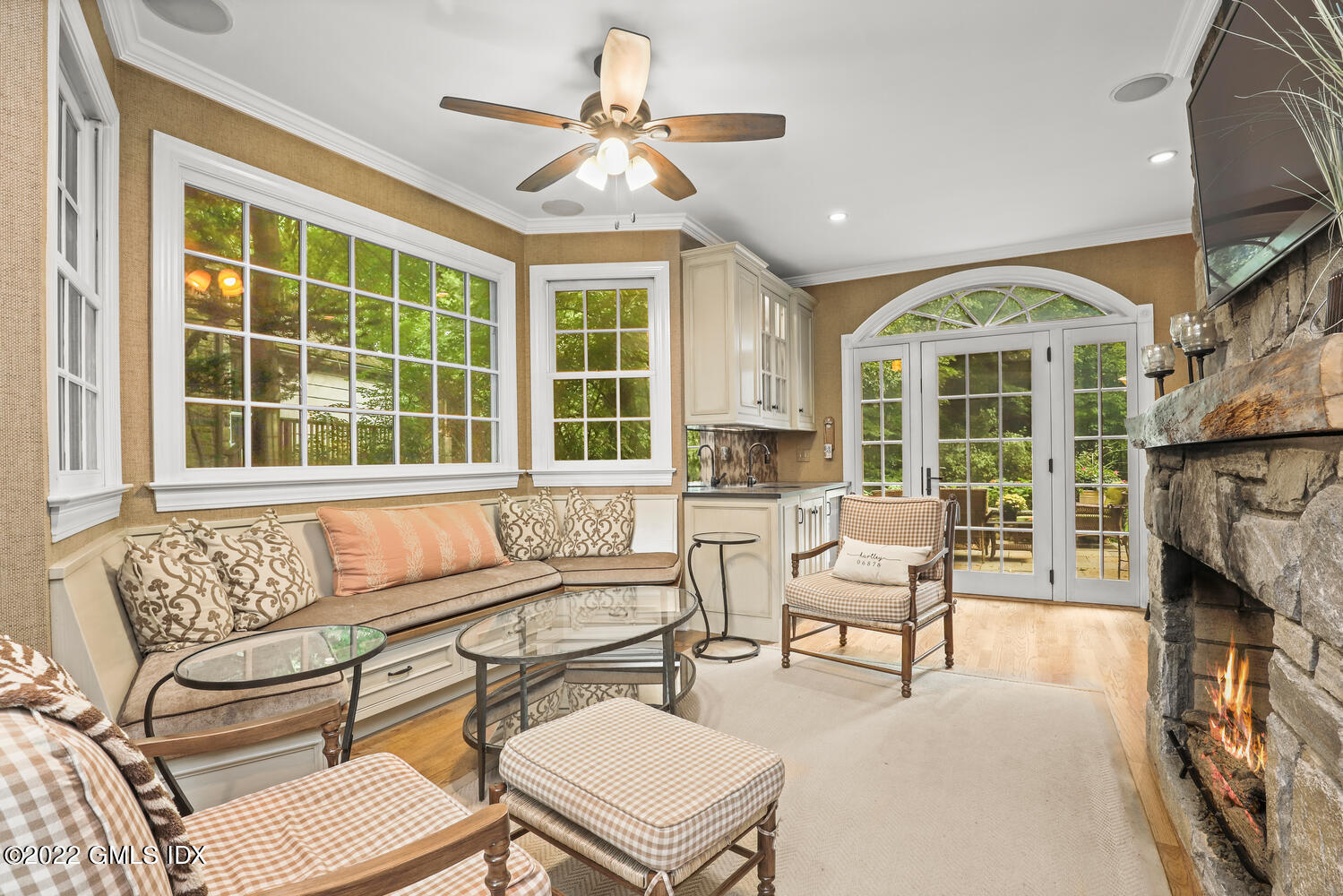 20 Crescent Road Riverside, CT 06878 - Photo 9 of 46 a living room with furniture a fireplace and a large window