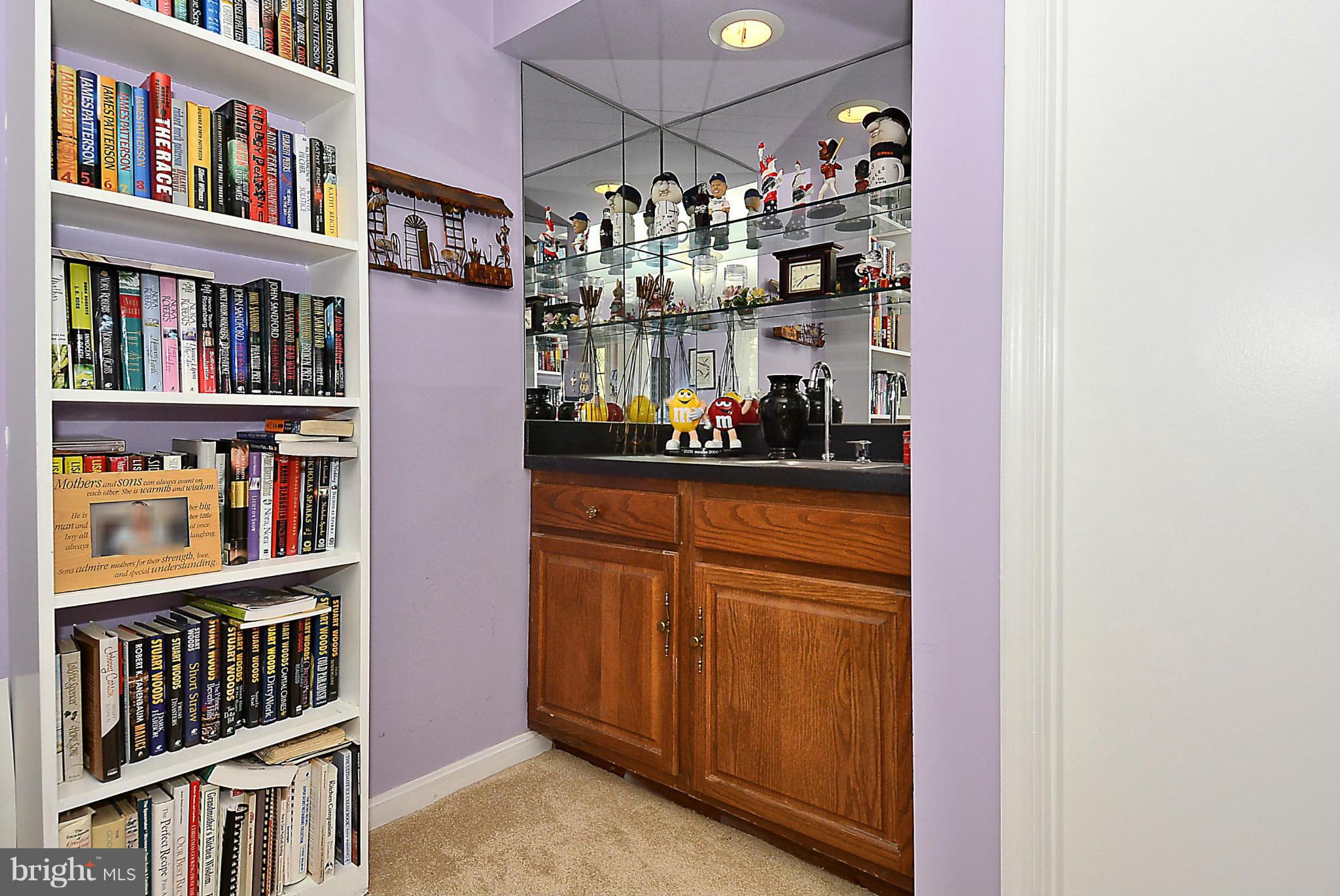 10404 Mountain Quail Road Silver Spring, MD 20901 - Photo 14 of 30 a room with lots of books and cabinets