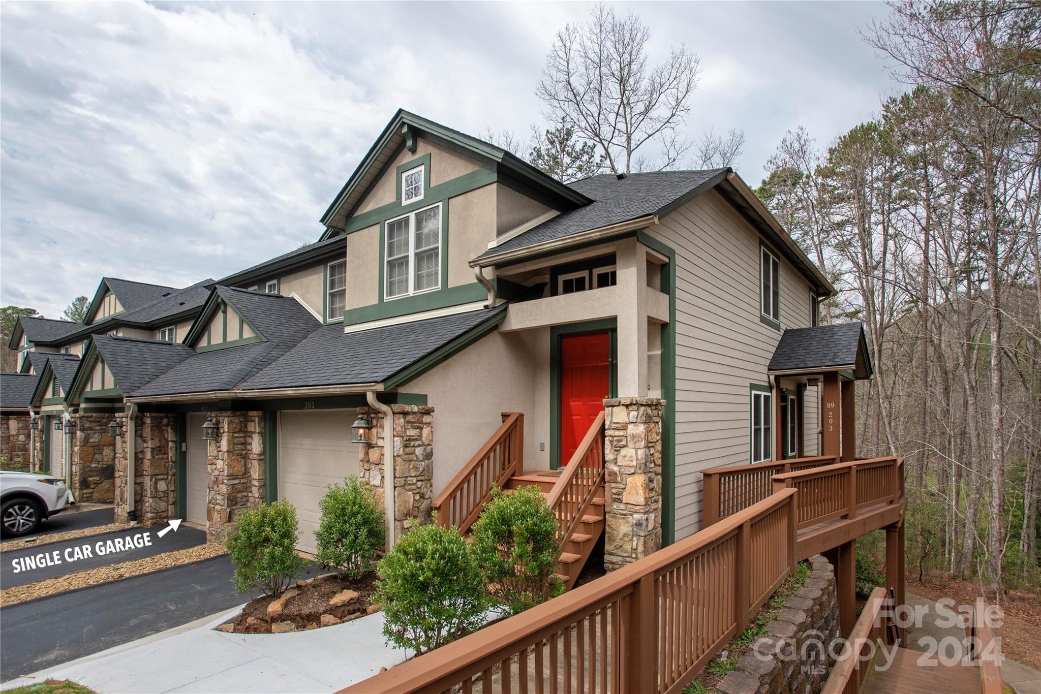 99 Ridgetop Circle, Unit 203 Brevard, NC 28712 - Photo 1 of 36 a front view of a house with balcony