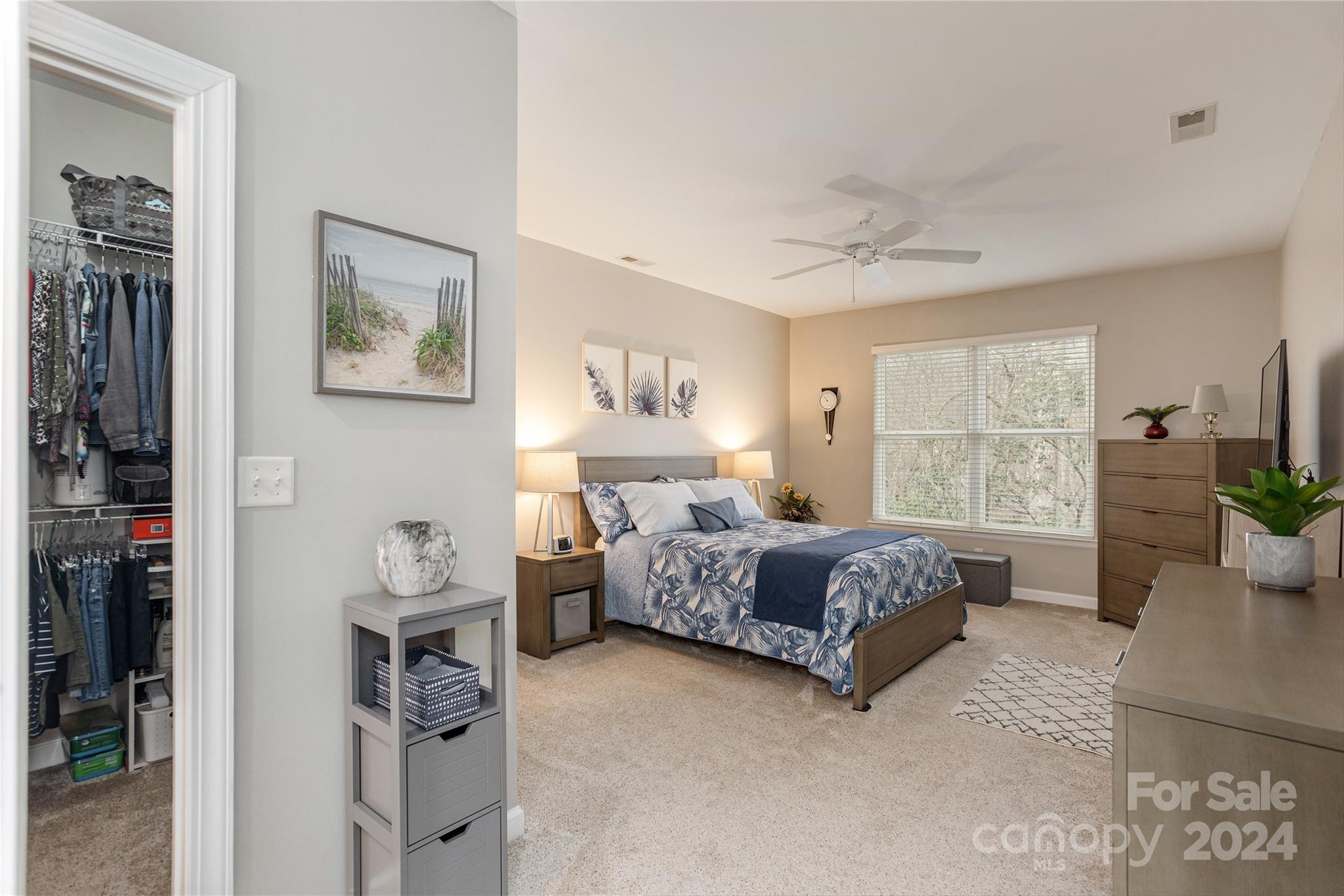 99 Ridgetop Circle, Unit 203 Brevard, NC 28712 - Photo 13 of 36 a spacious bedroom with a bed and wooden floor