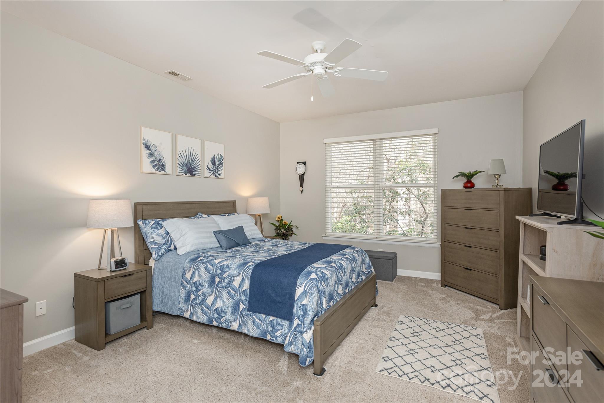 99 Ridgetop Circle, Unit 203 Brevard, NC 28712 - Photo 14 of 36 a bedroom with a bed closet and flat tv screen