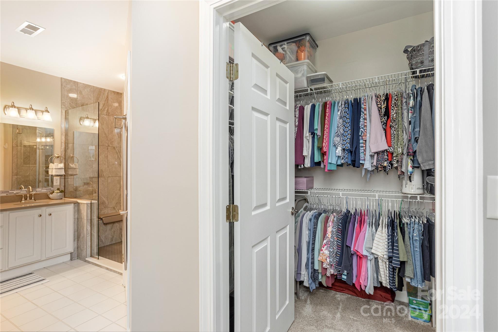 99 Ridgetop Circle, Unit 203 Brevard, NC 28712 - Photo 16 of 36 a view of walk in closet with clothes and shoes
