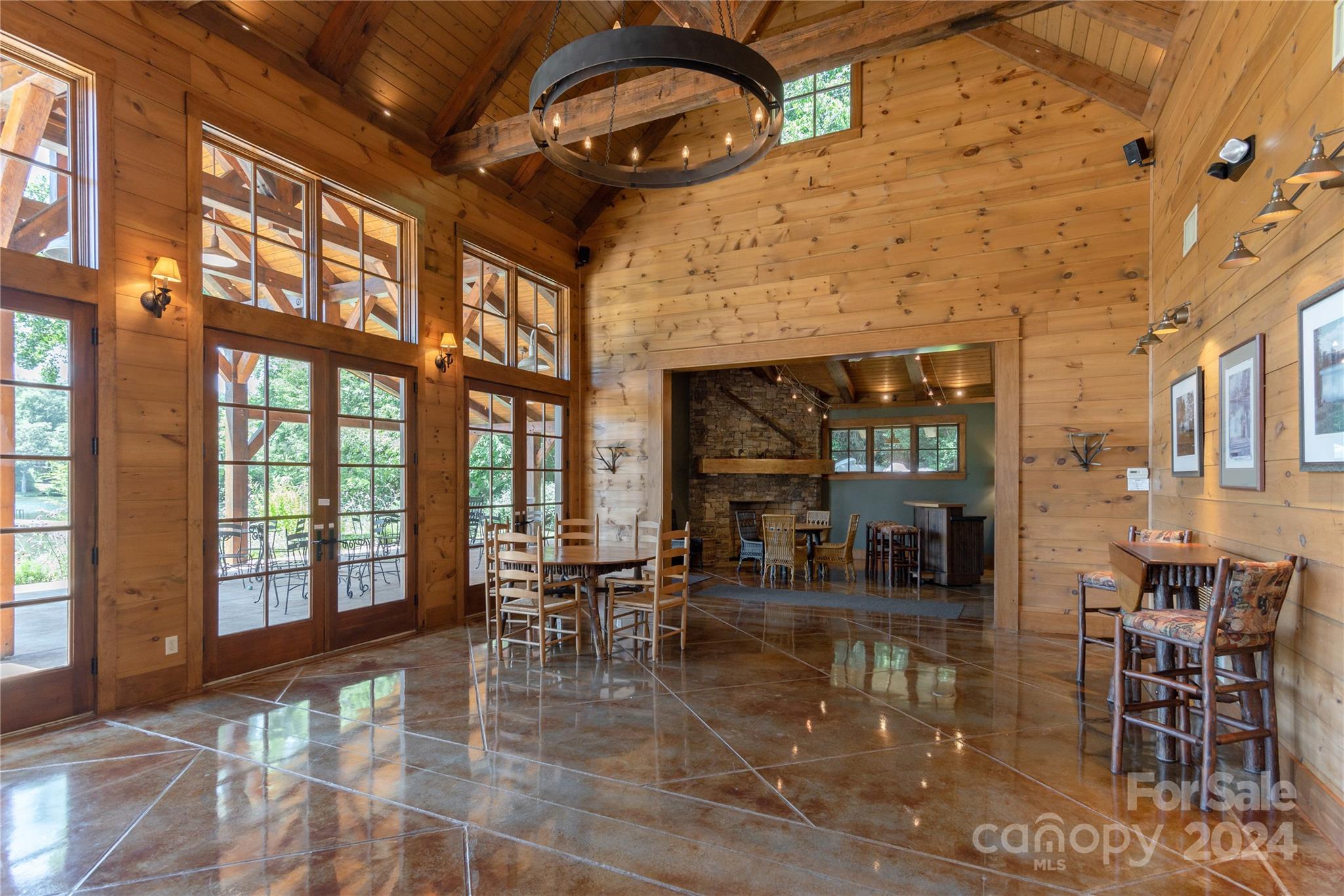 99 Ridgetop Circle, Unit 203 Brevard, NC 28712 - Photo 26 of 36 a dining room with lots of tables and chairs