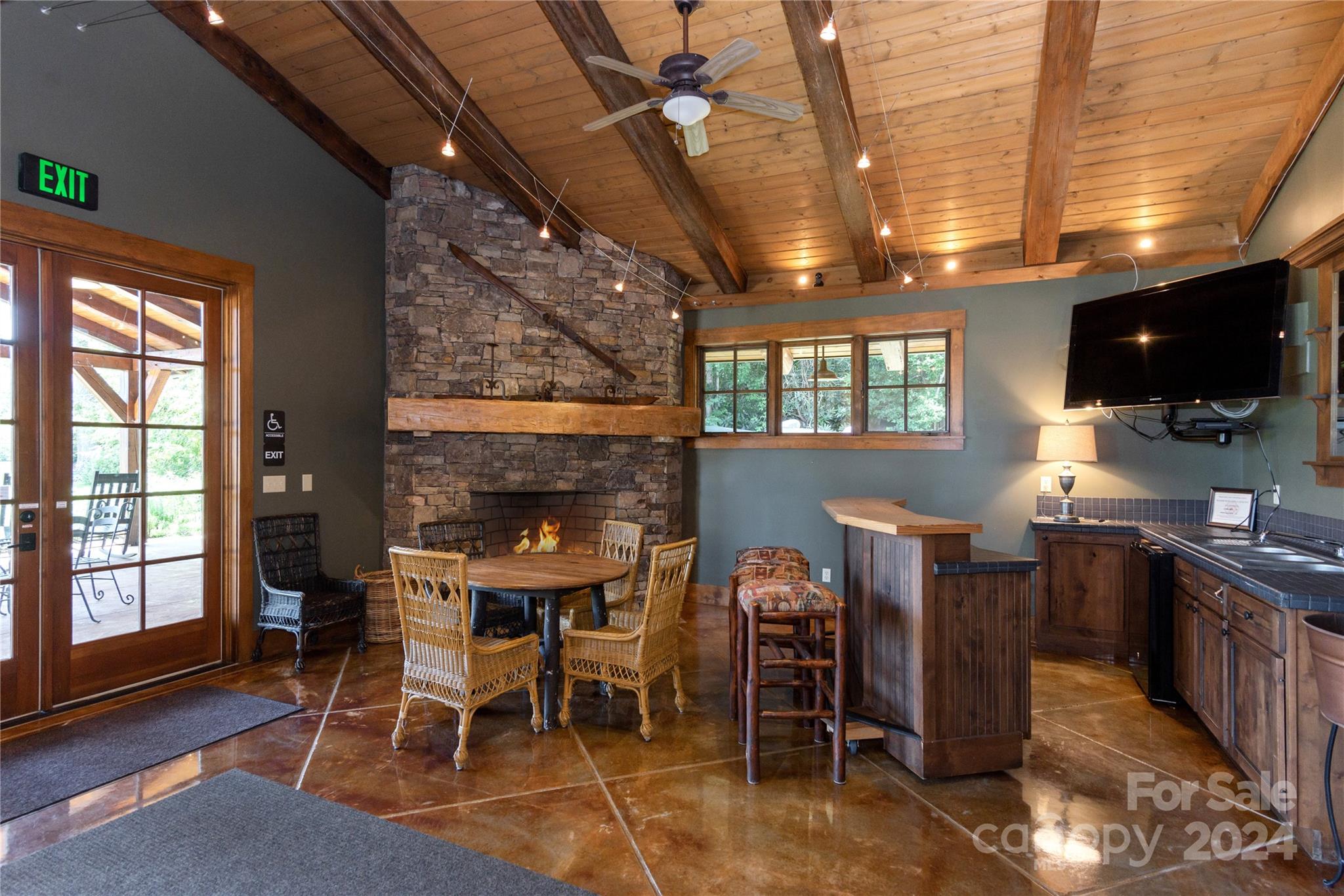 99 Ridgetop Circle, Unit 203 Brevard, NC 28712 - Photo 27 of 36 a view of a dining room with furniture and window