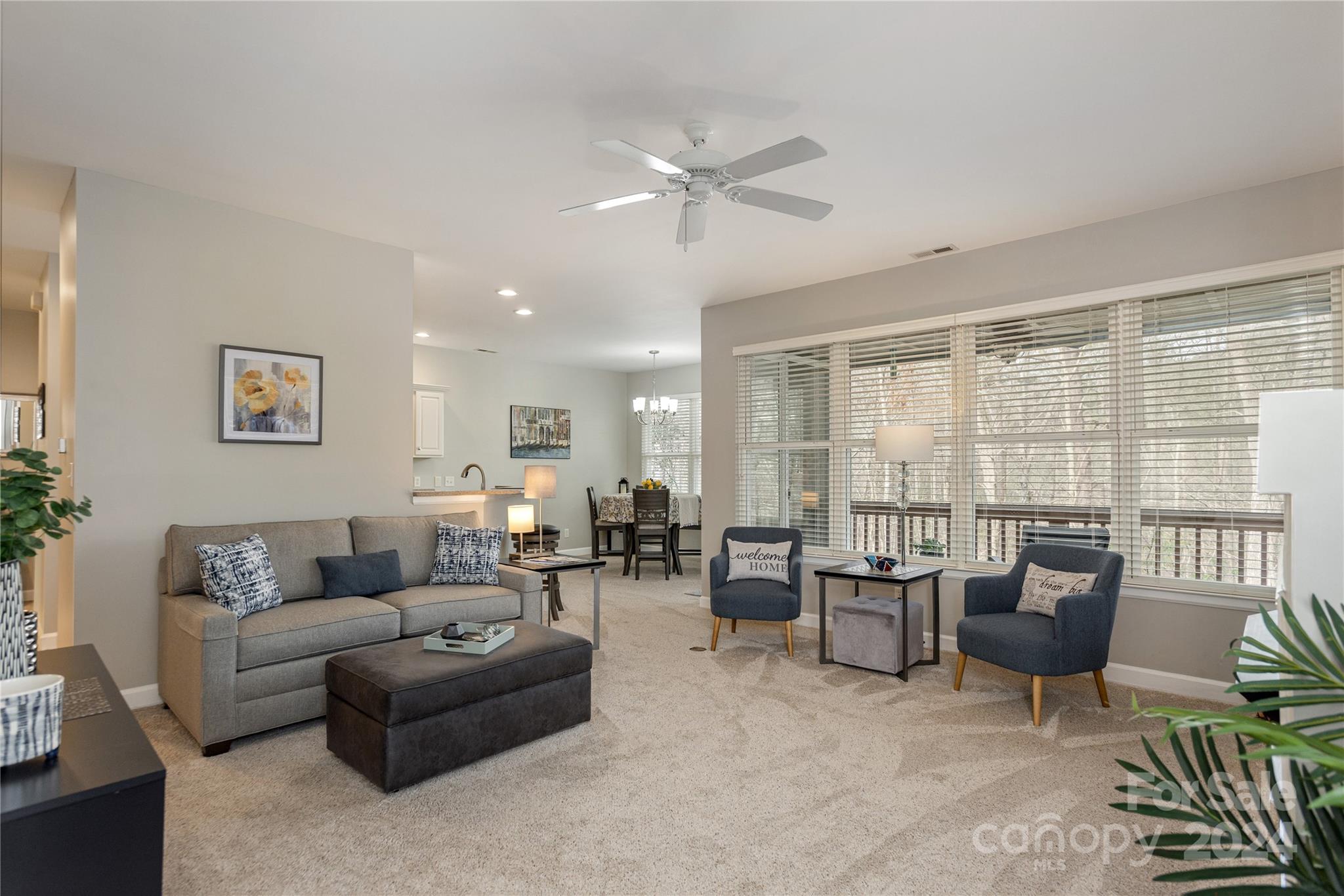 99 Ridgetop Circle, Unit 203 Brevard, NC 28712 - Photo 7 of 36 a living room with furniture and large windows