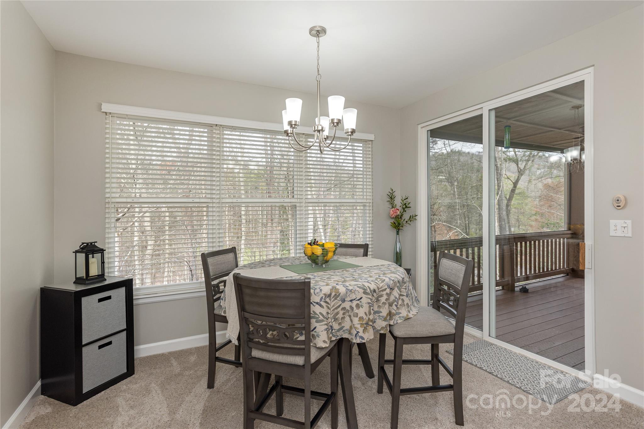 99 Ridgetop Circle, Unit 203 Brevard, NC 28712 - Photo 9 of 36 a dining room with furniture and window